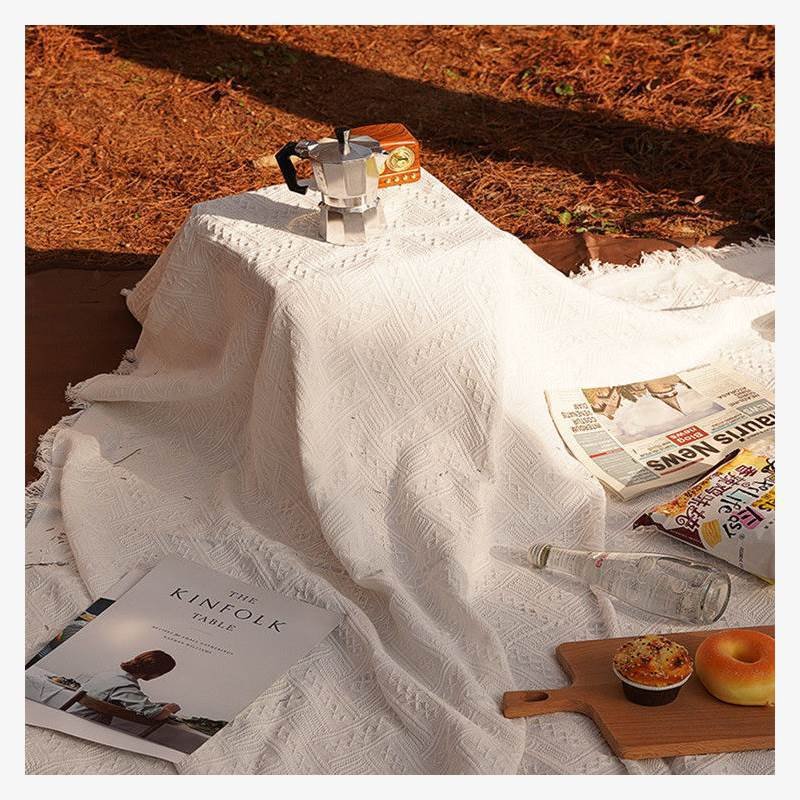 A picnic mat, camping outdoors, white blankets, beach mats, a French beach mat