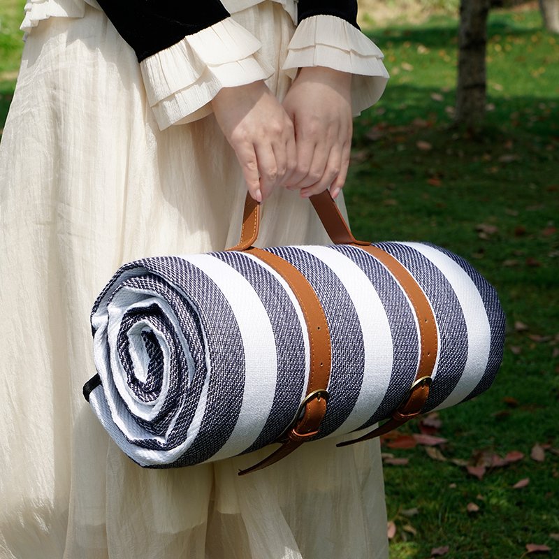 A picnic mat with a thick picnic cloth and a waterproof camping tent pad