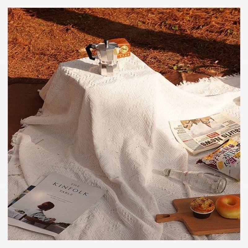 A picnic mat, camping outdoors, white blankets, beach mats, a French beach mat