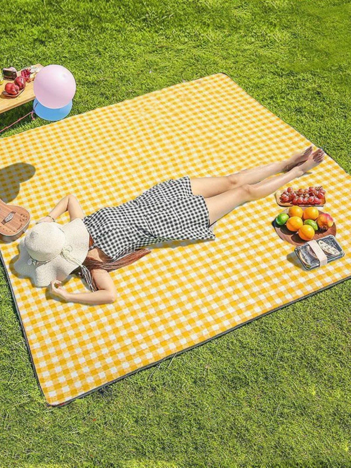 A picnic mat with a thick picnic cloth and a camping tent with a camping pad