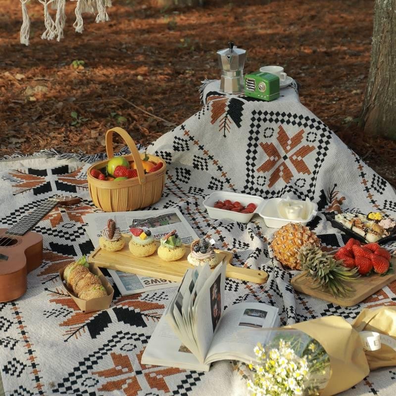 A picnic mat with a thick tent, a camping blanket, and a beach mat for the spring camp