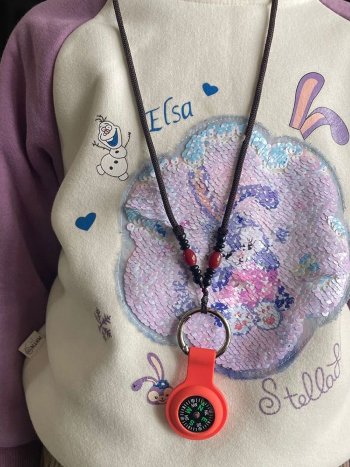 An out-of-door camper key to a necklace child guide student test pointer