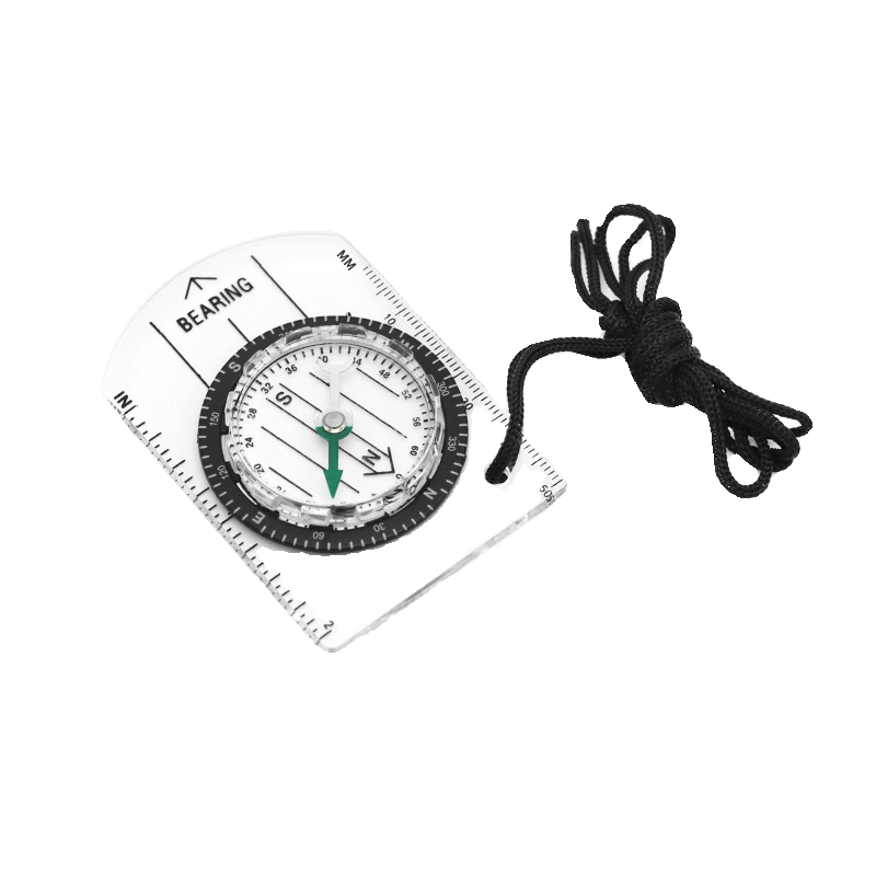 A professional multi-purpose compass for outdoor equipment in the wilderness points to a scale-scale compass of the north map