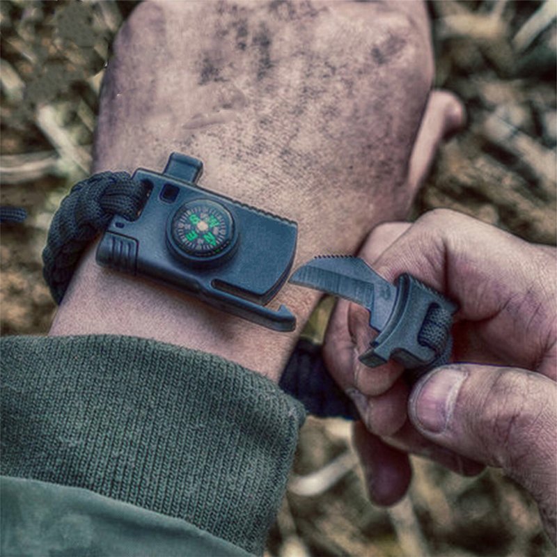 An outdoor umbrella and a multi-purpose field tactical life-rescue slicing bracelet