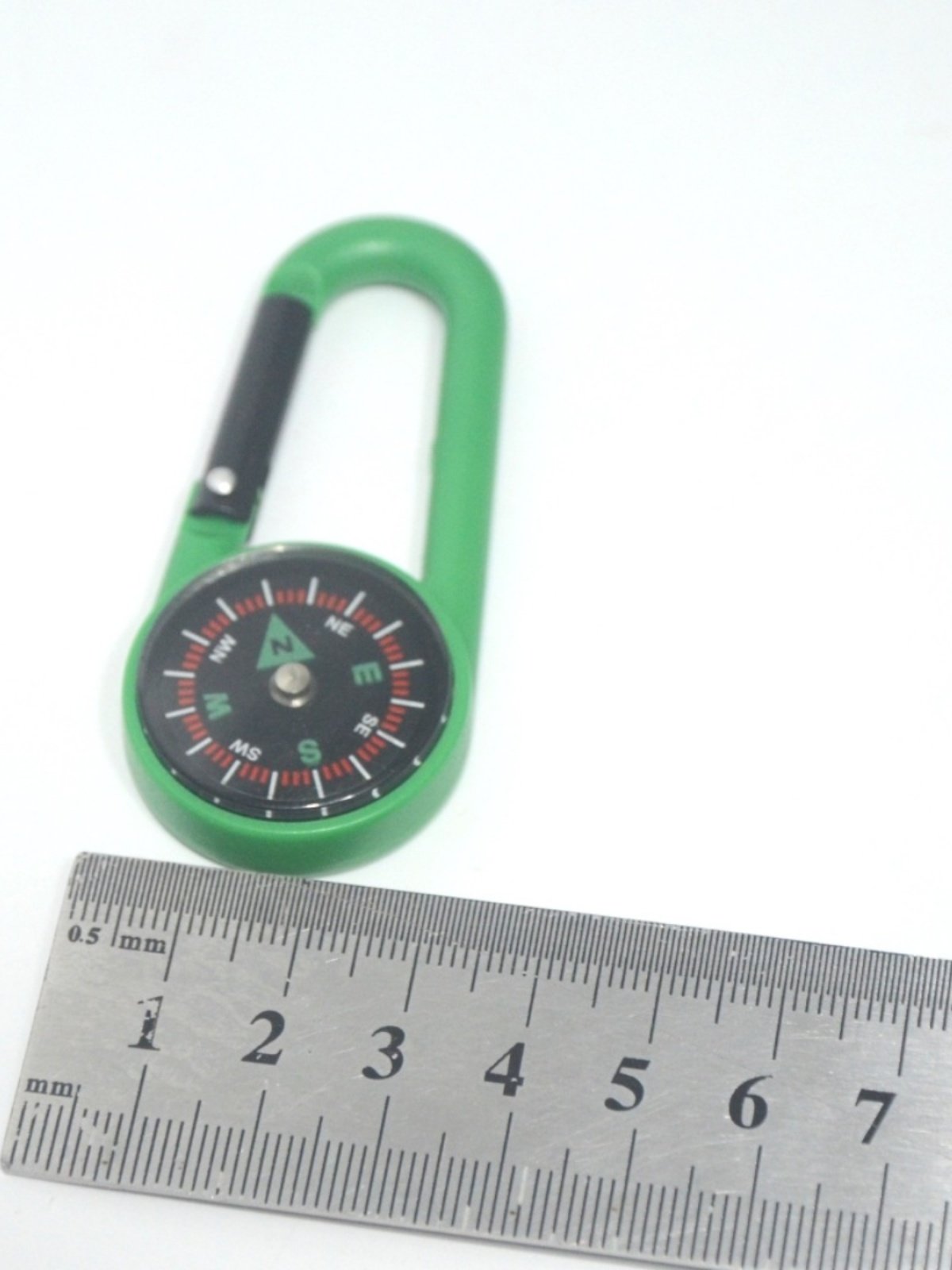 The multi-purpose outdoor navigation compass points to the north needle