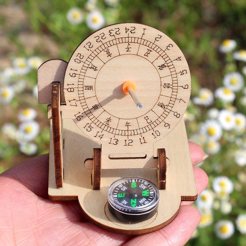 a compass and a solar dialytic model, small-scale production of ancient timers hand-forming creative fun material