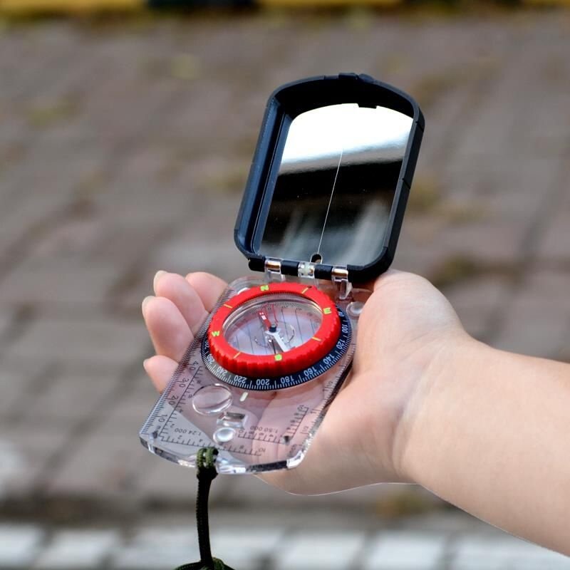 An outdoor multi-purpose guide with a northerly northerly pointer, map the sports angle light