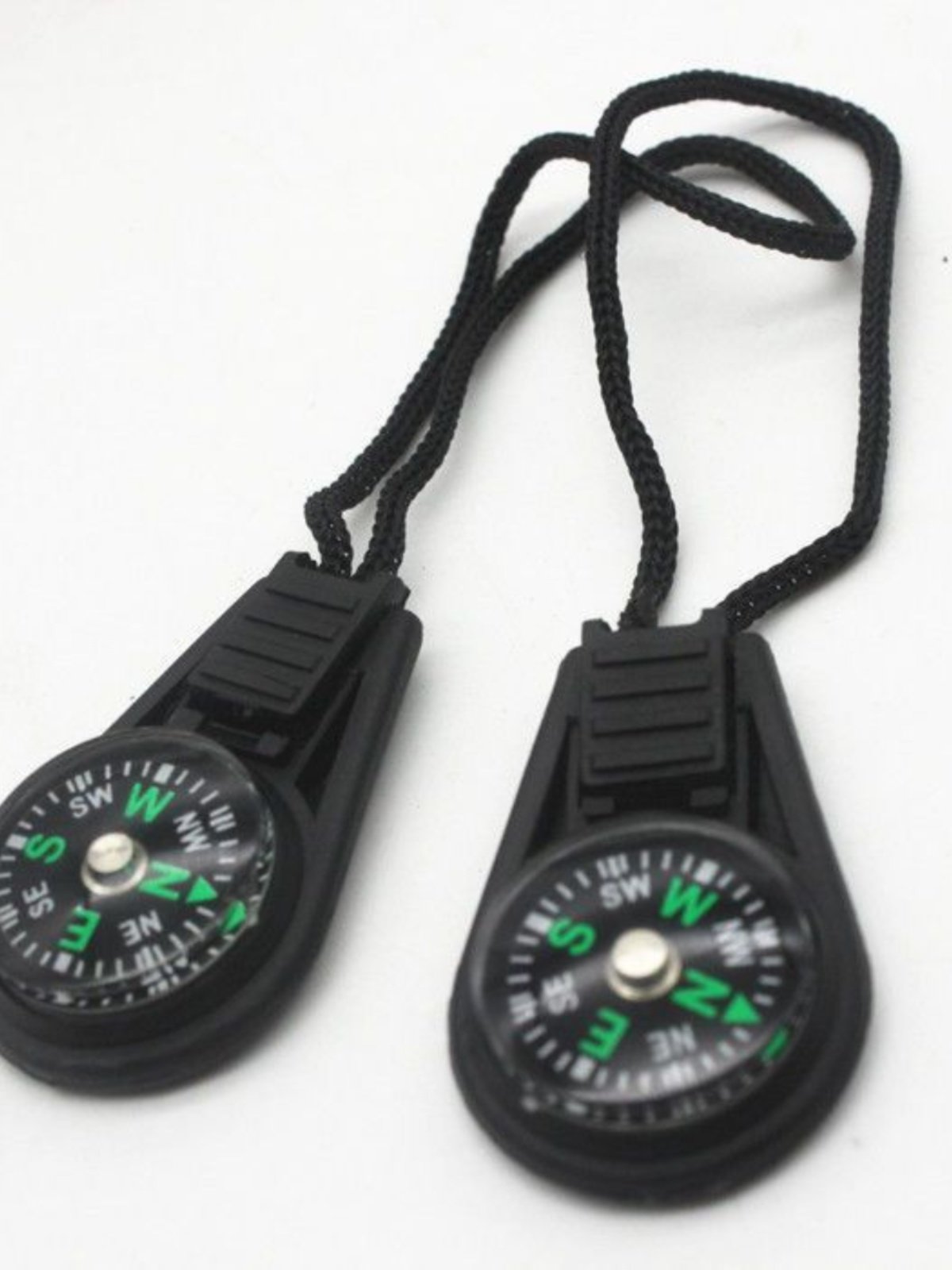 An outdoor tripping compass linked to a multi-functional fast-track compass, a portable liquid suspension pointer
