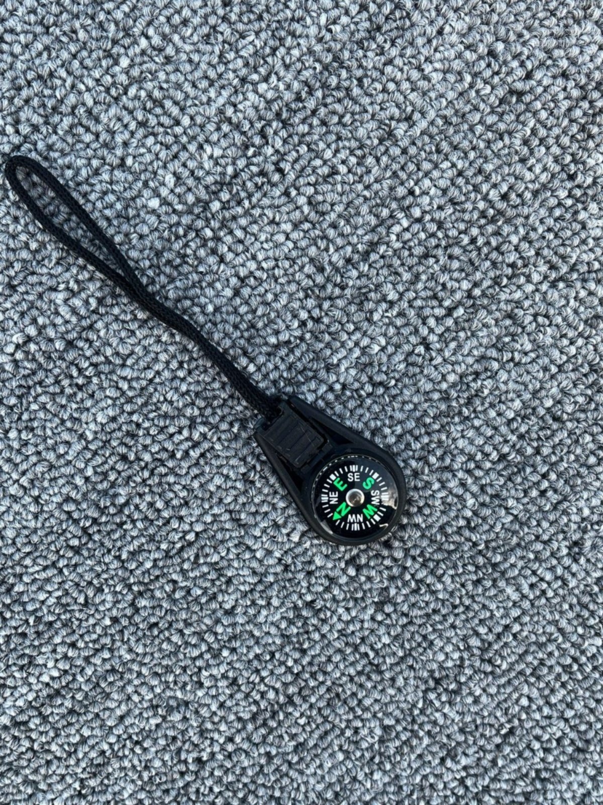 An outdoor tripping compass linked to a multi-functional fast-track compass, a portable liquid suspension pointer