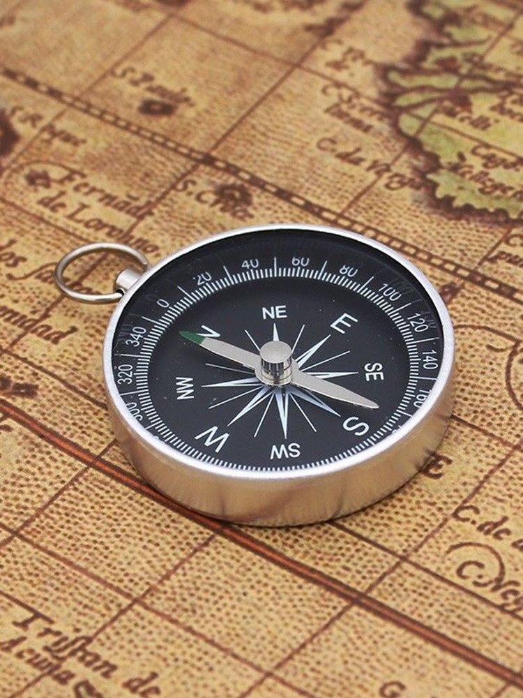 THE G44 DIAMETER RING KEY BUTTON IS USED TO POINT THE NORTHERLY POINTER WITH THE ALUMINUM ALLOY TO THE FIELD CAMP