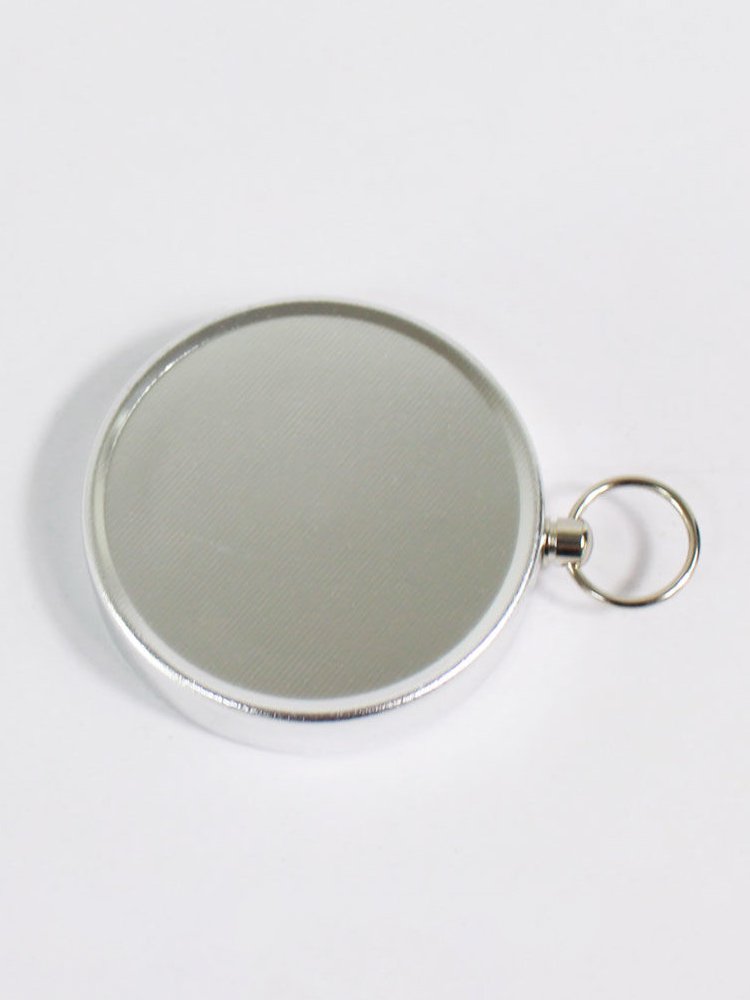 THE G44 DIAMETER RING KEY BUTTON IS USED TO POINT THE NORTHERLY POINTER WITH THE ALUMINUM ALLOY TO THE FIELD CAMP
