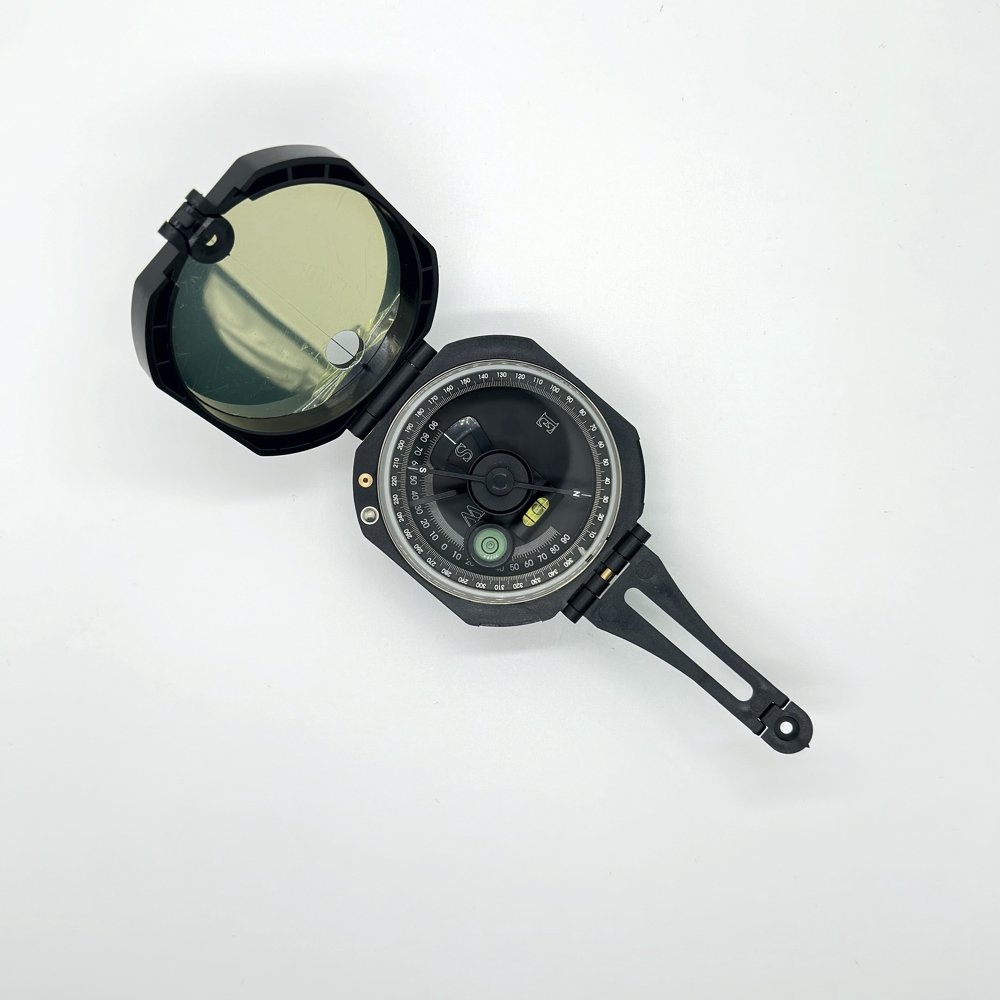 An outdoor multi-purpose guide to camp-and-mount high-precision nightlight point to a northern pin with a plastic American geological compass