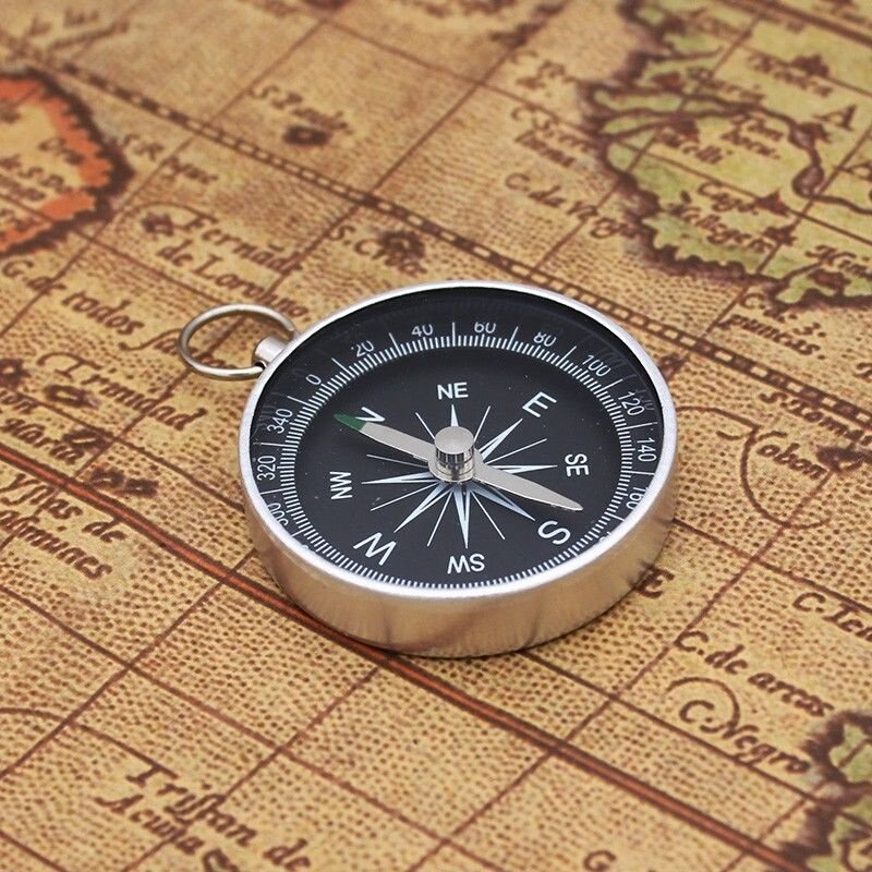 THE G44 DIAMETER RING KEY BUTTON IS USED TO POINT THE NORTHERLY POINTER WITH THE ALUMINUM ALLOY TO THE FIELD CAMP
