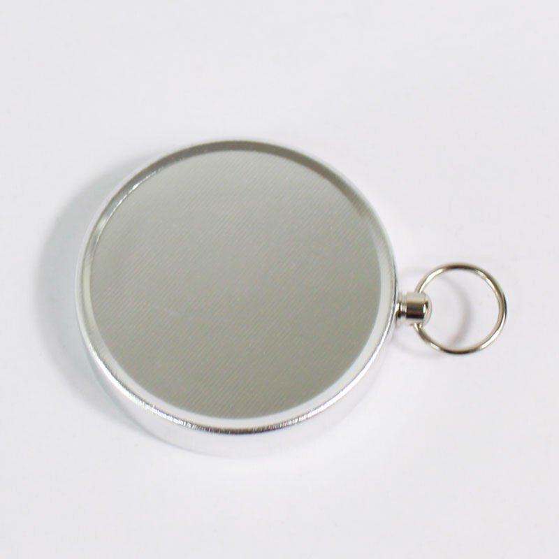 THE G44 DIAMETER RING KEY BUTTON IS USED TO POINT THE NORTHERLY POINTER WITH THE ALUMINUM ALLOY TO THE FIELD CAMP