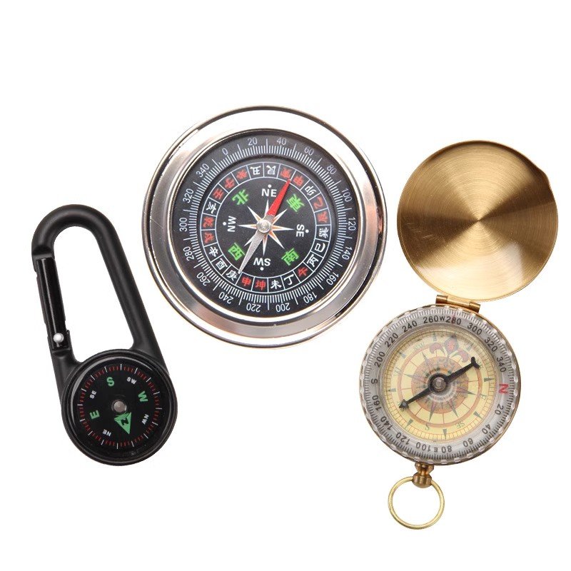 An outdoor compass for a child with a high-precision sports climber pointed the nightlight to the north needle