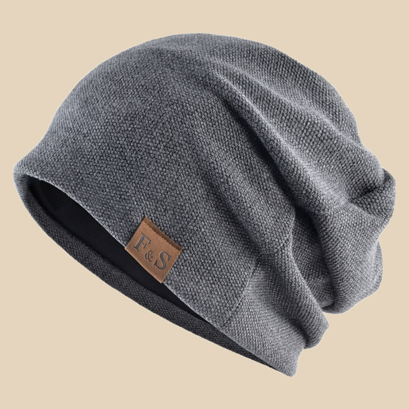 The woman who sleeps at night with the hat she wears in the winter wind and she's covered with the head hat and the sweaty sleep hat man