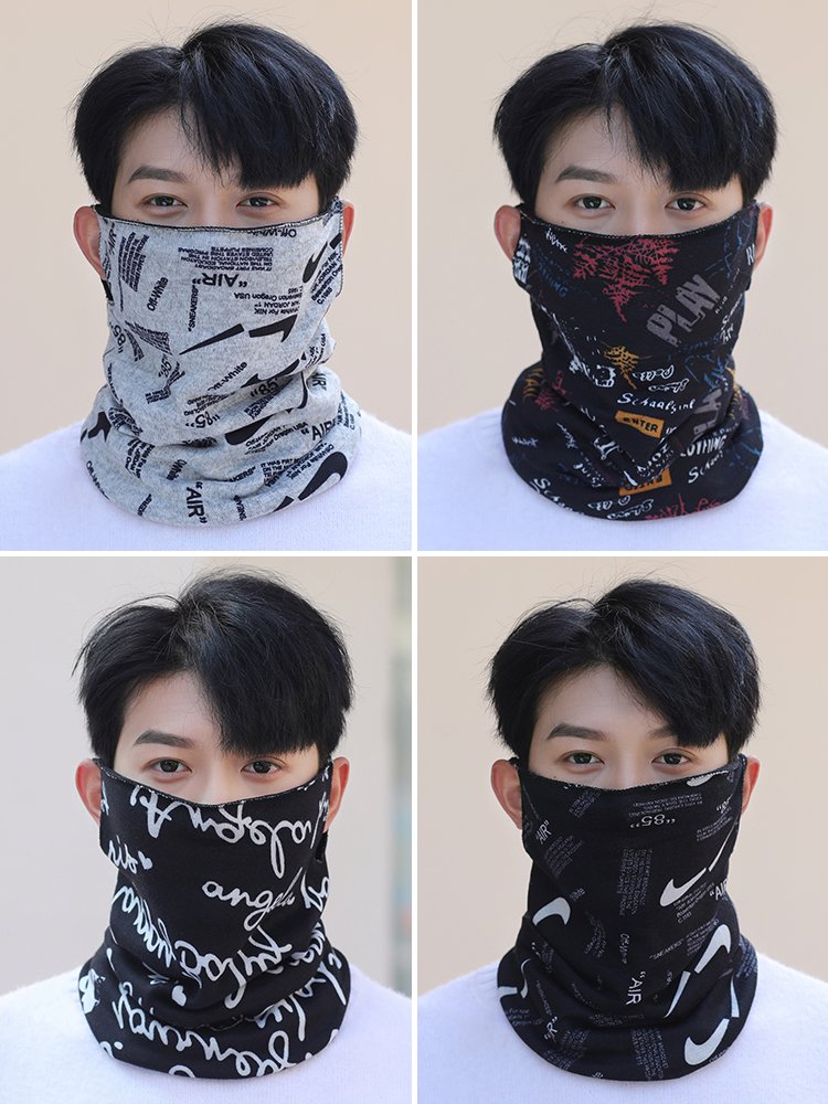 A man riding a hood for his neck in the winter