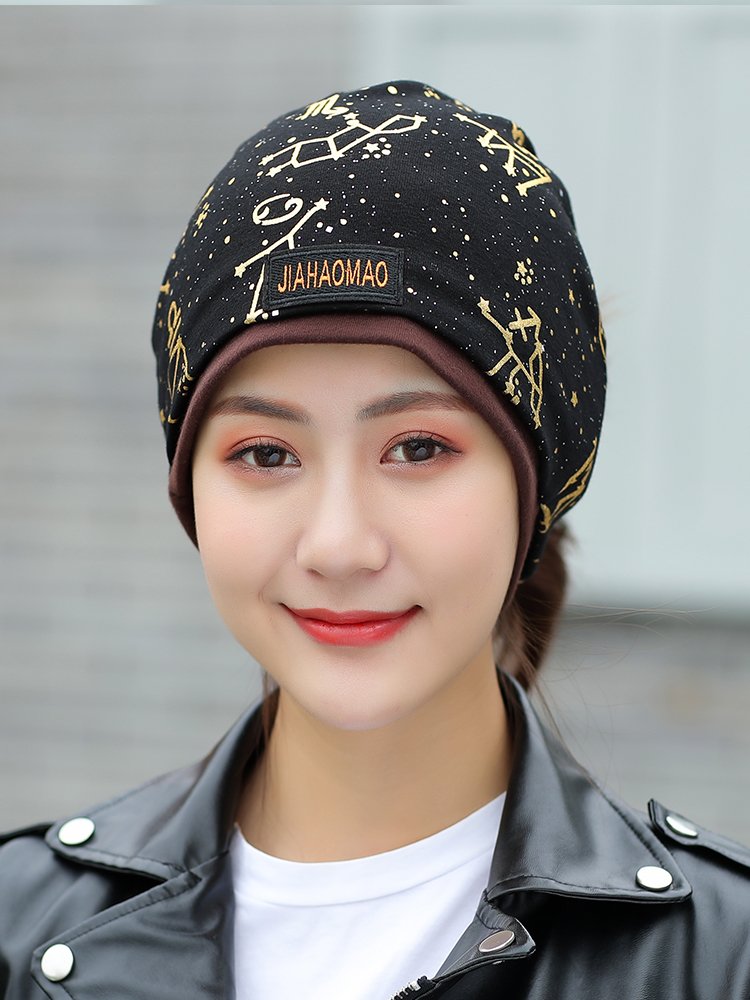 Ms. New Gold Hat, warm-up necks in the winter with a pile of caps and headscarves on the street