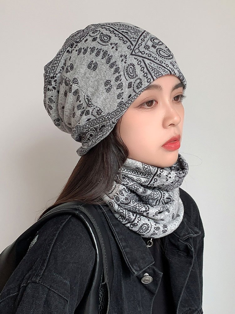 A new, multi-purpose cap on the neck of a girl with a cyclist to keep her warm