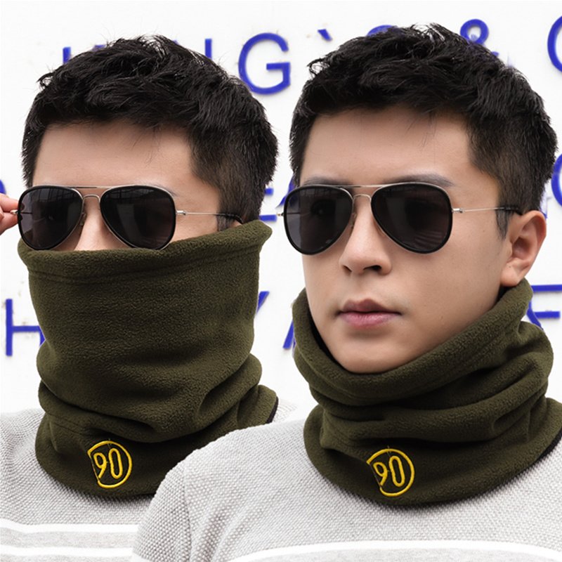 The hooded man warms himself in winter and warms his neck in winter