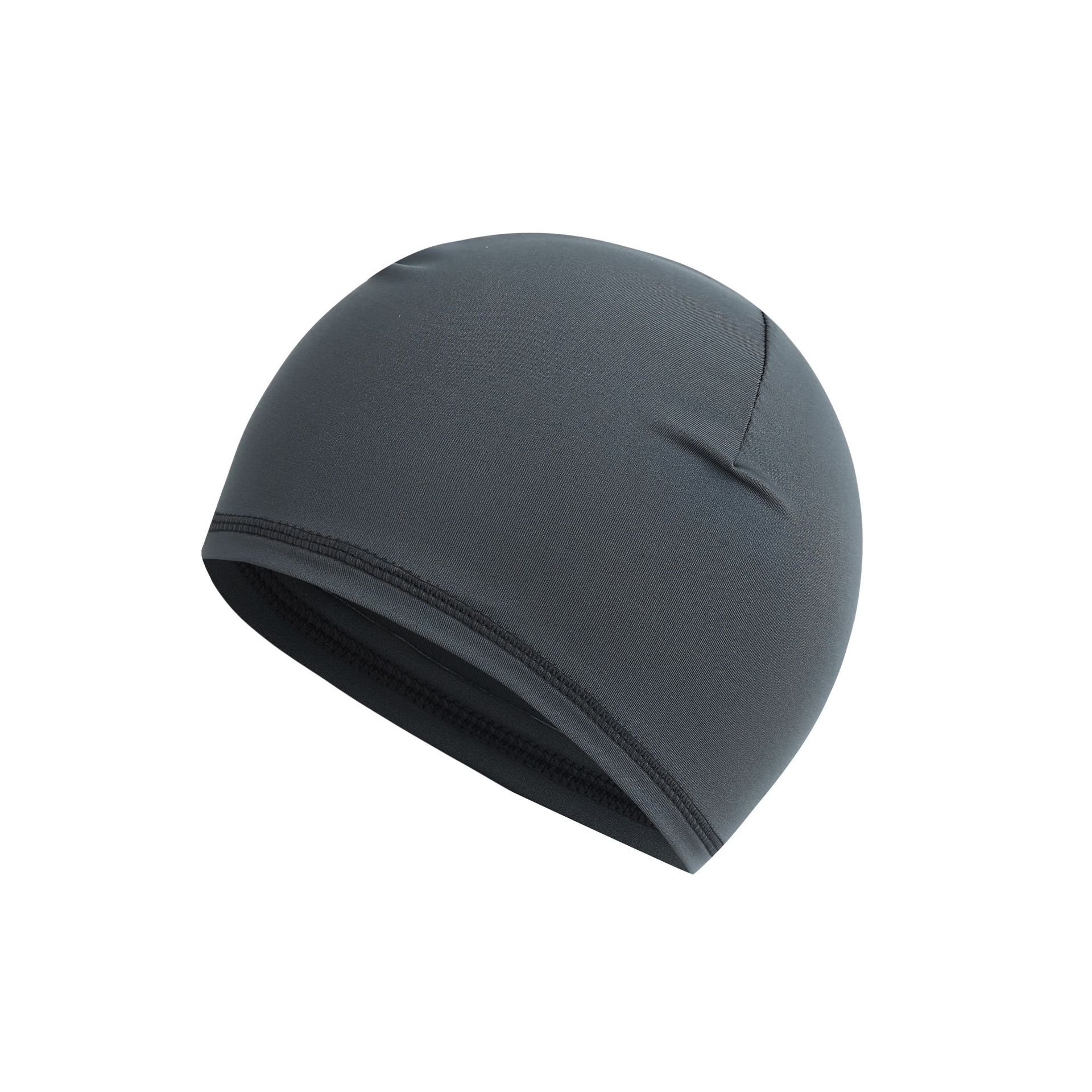 A bike turban man with a little hat and a thin helmet with a sweat-in-the-breath hood