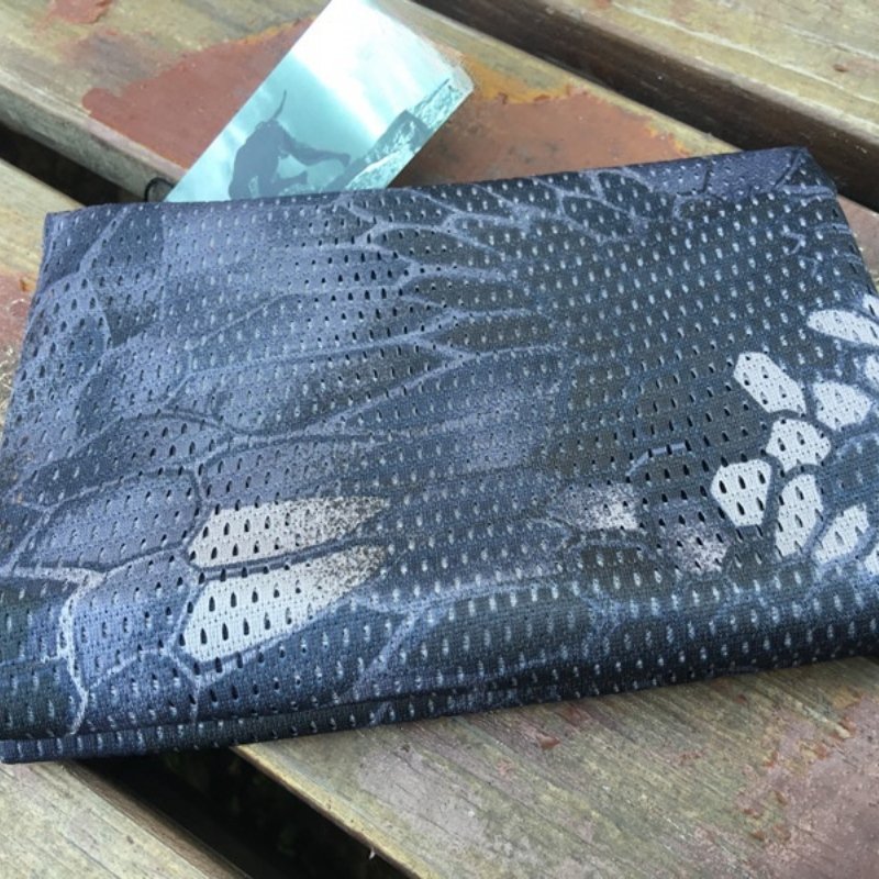 The army's hot-coloured scarf outside of the house