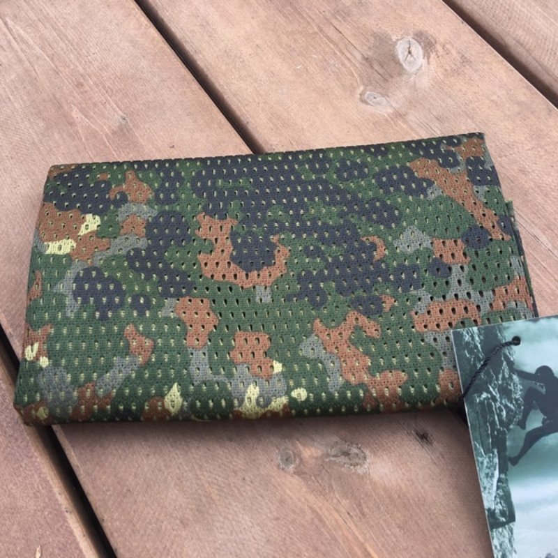 The army's hot-coloured scarf outside of the house