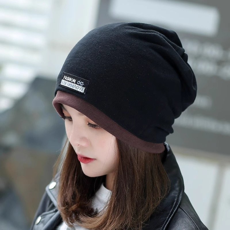 A woman with a winter cap and a twilight twilight twilight cap and a twilight cap