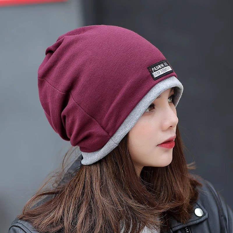 A woman with a winter cap and a twilight twilight twilight cap and a twilight cap
