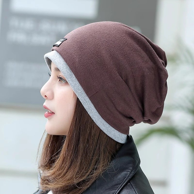 A woman with a winter cap and a twilight twilight twilight cap and a twilight cap