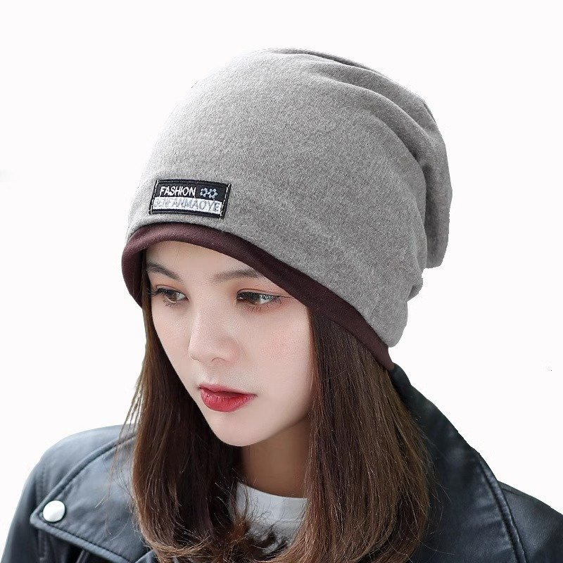 A woman with a winter cap and a twilight twilight twilight cap and a twilight cap