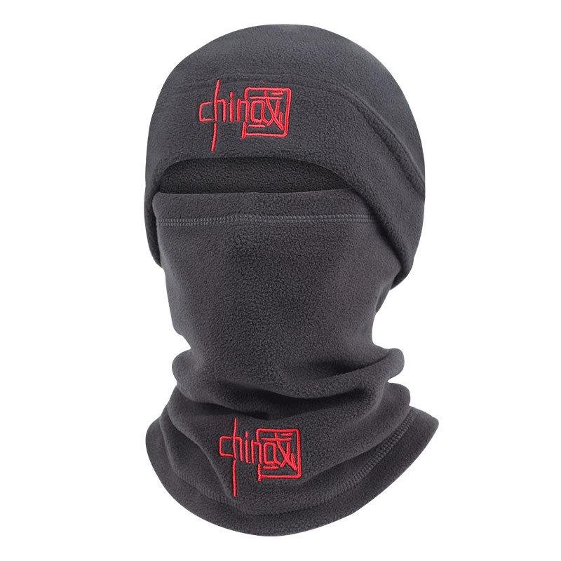 A man who rides an outdoor ski mask in winter with a cold-proof heater hat around a mountain climber