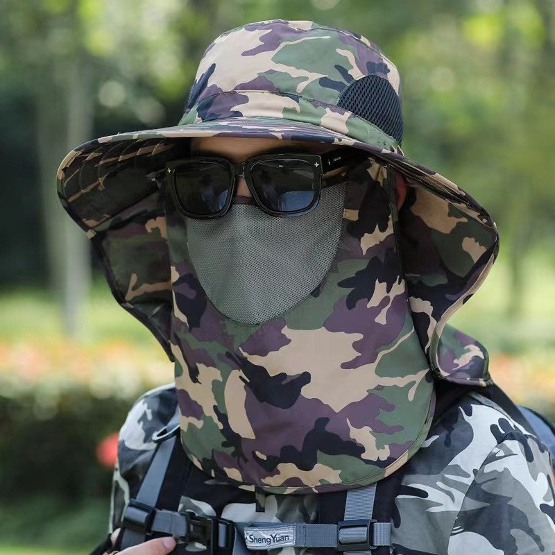 A man's shawl and a man's tan man's hat and a man's hat can fold