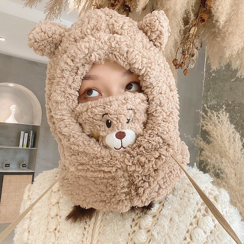 With a hat and a lovely fashion mask, a bonnet and an ear-protector ride in winter