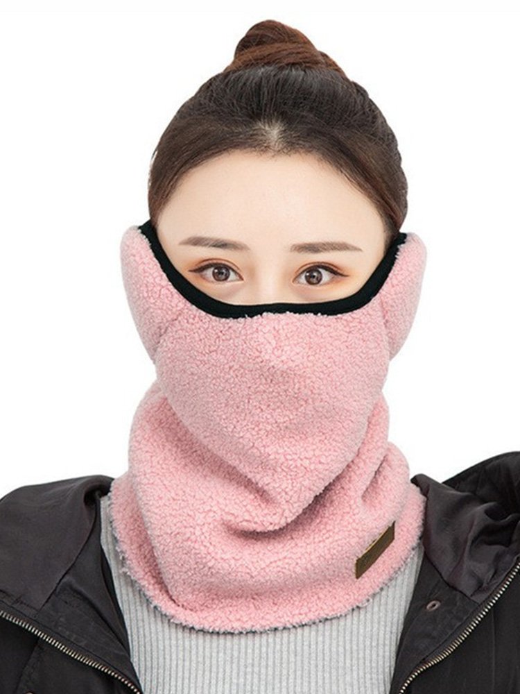 Ride on a winter ski mask for a woman with a winter motorcycle to protect her ears from the wind