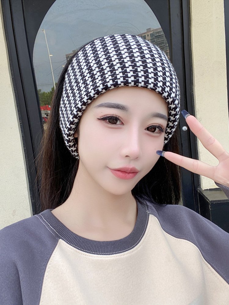 He's wearing a headscarf around a woman in the autumn and winter