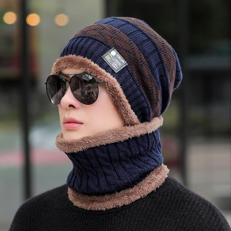 A man with a hat and a tweezer in winter and a warm, warm, cold, outdoor, cold cycling to a mountain and a winter cotton hat