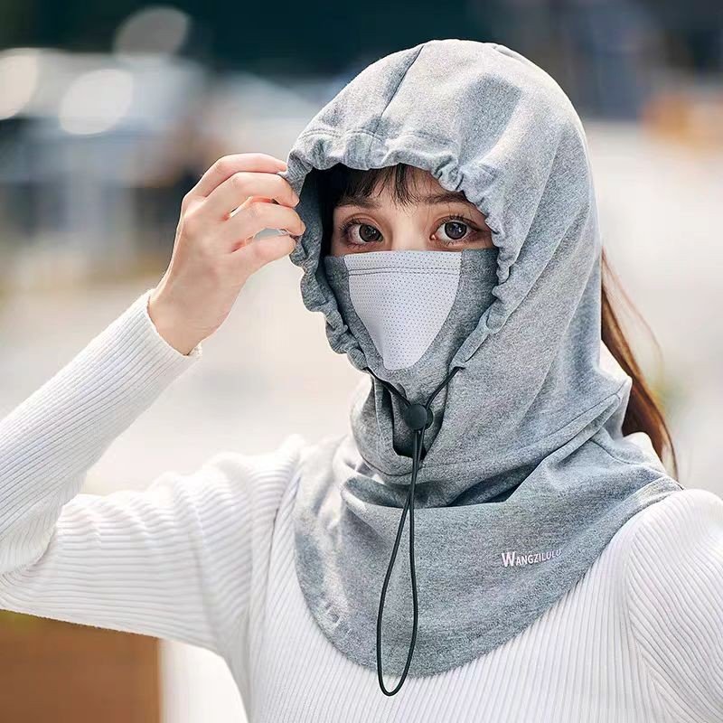 The winter man lady rides a snowboarding hood, a wind hat and a dust mask hat