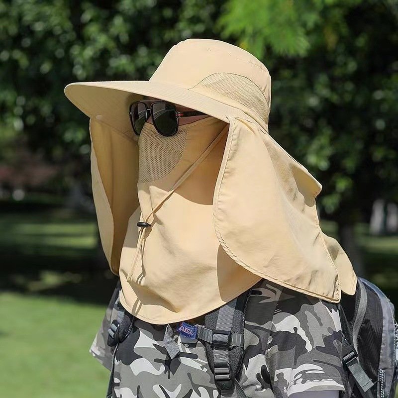 A man with a new sunscreen hat and a fish hat outside can detach a UV cap