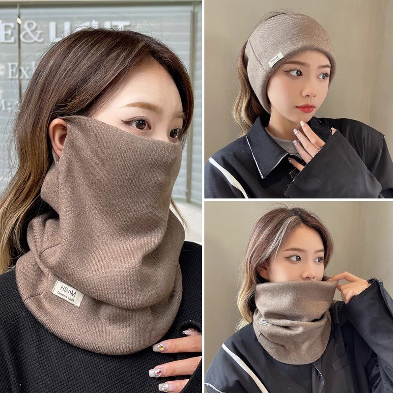 Autumn and winter, the lady with her ear mask to keep her neck covered with a scarf to protect her from the wind