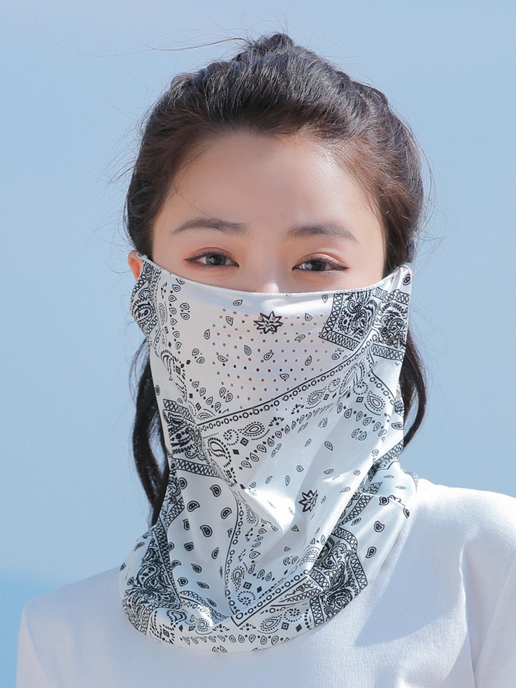 In summer, the masked woman covered her face with sun and neck under a hood of ice