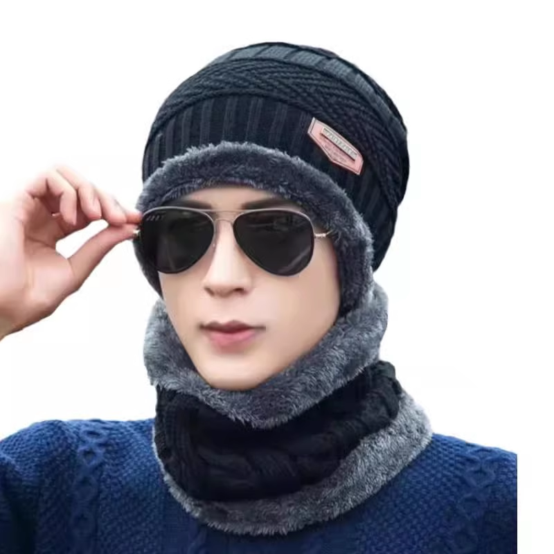 The man in the hat keeps his head warm in the winter and he puts a velvet on his head and a thick wind