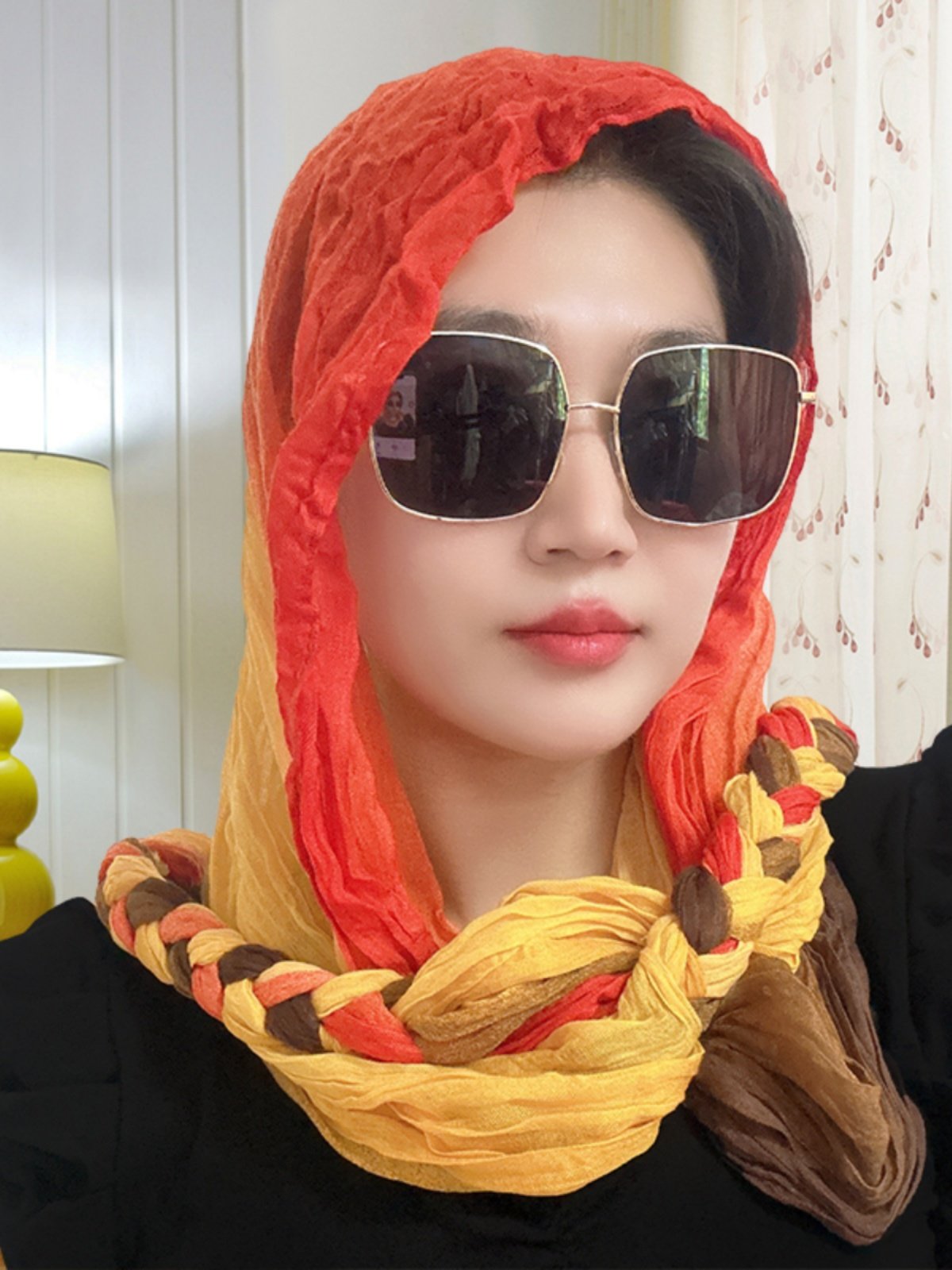 A girl with a turban on her wrinkles and a new twirl with a twirl on her neck and a twirl