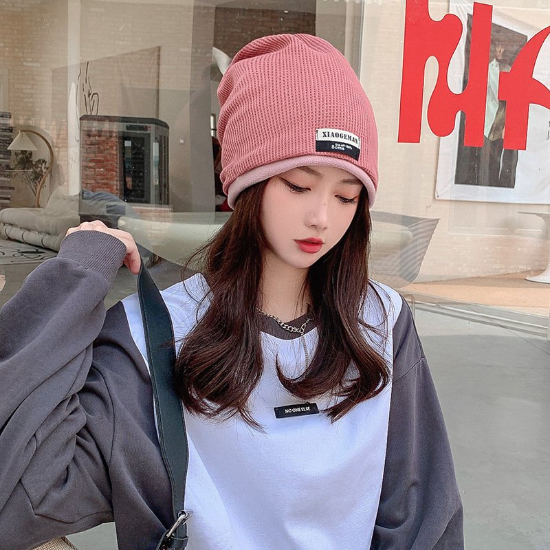 The woman's hats are heated and she's knitted