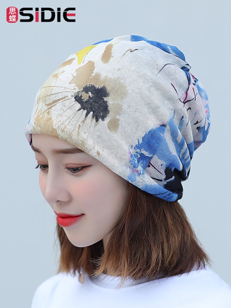 Ms. National Monopolitan Hat rides the gas turbans outside the house