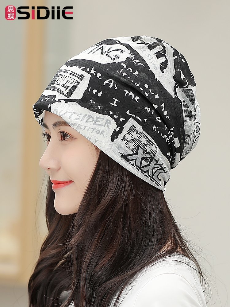 Ms. National Monopolitan Hat rides the gas turbans outside the house