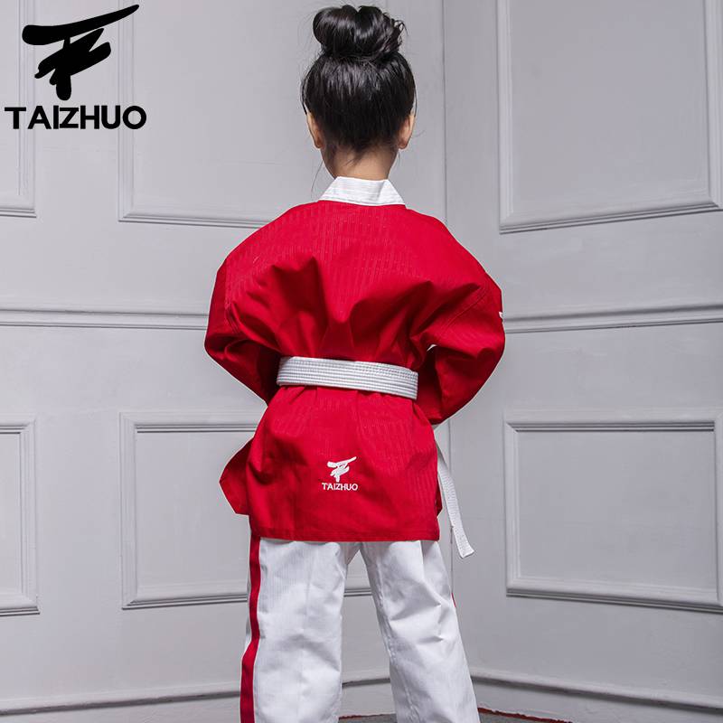 TETRE IS A TAEKWONDO SUIT, A CHILD'S AND A GIRL'S DRESS, A RED TKD PERFORMANCE