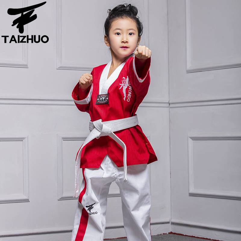 TETRE IS A TAEKWONDO SUIT, A CHILD'S AND A GIRL'S DRESS, A RED TKD PERFORMANCE