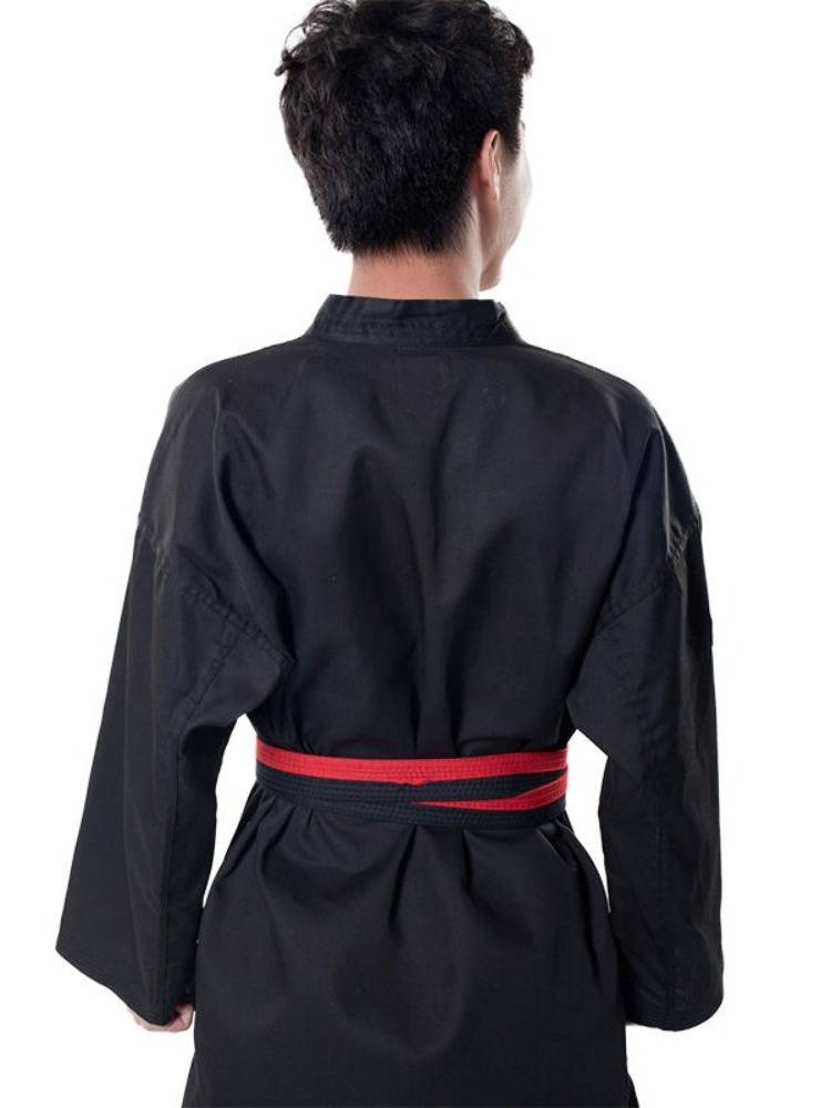 Taft coach wears a black taekwondo for adults and a master in a specialty taekwondo for men and women