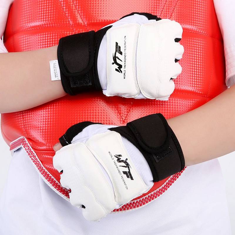 A child with a foot protection kit and a half-finger gloves for combat training